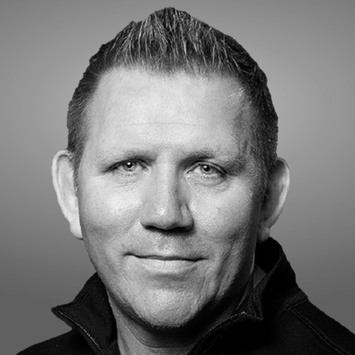 Black and white portrait of Crane Authentication President Dave Coombe