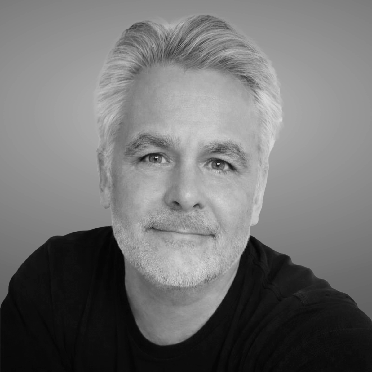 Black and white portrait of Crane Authentication staff member Chris O’Brien at industry event