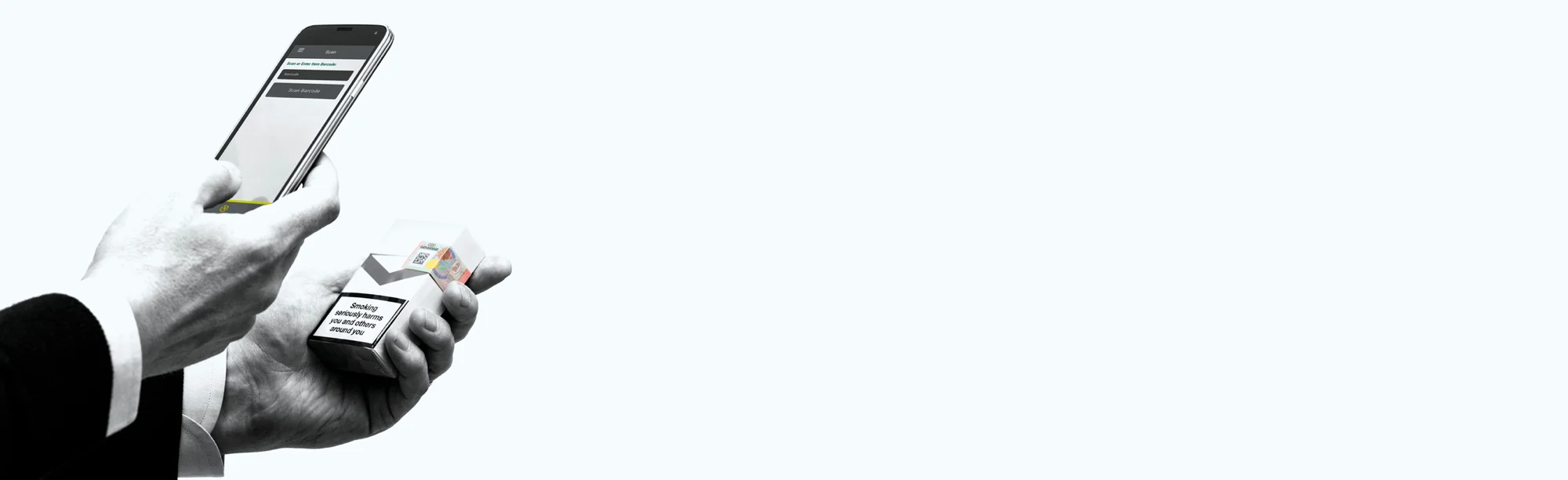 Close-up of cigarette pack label being scanned with an app for security verification