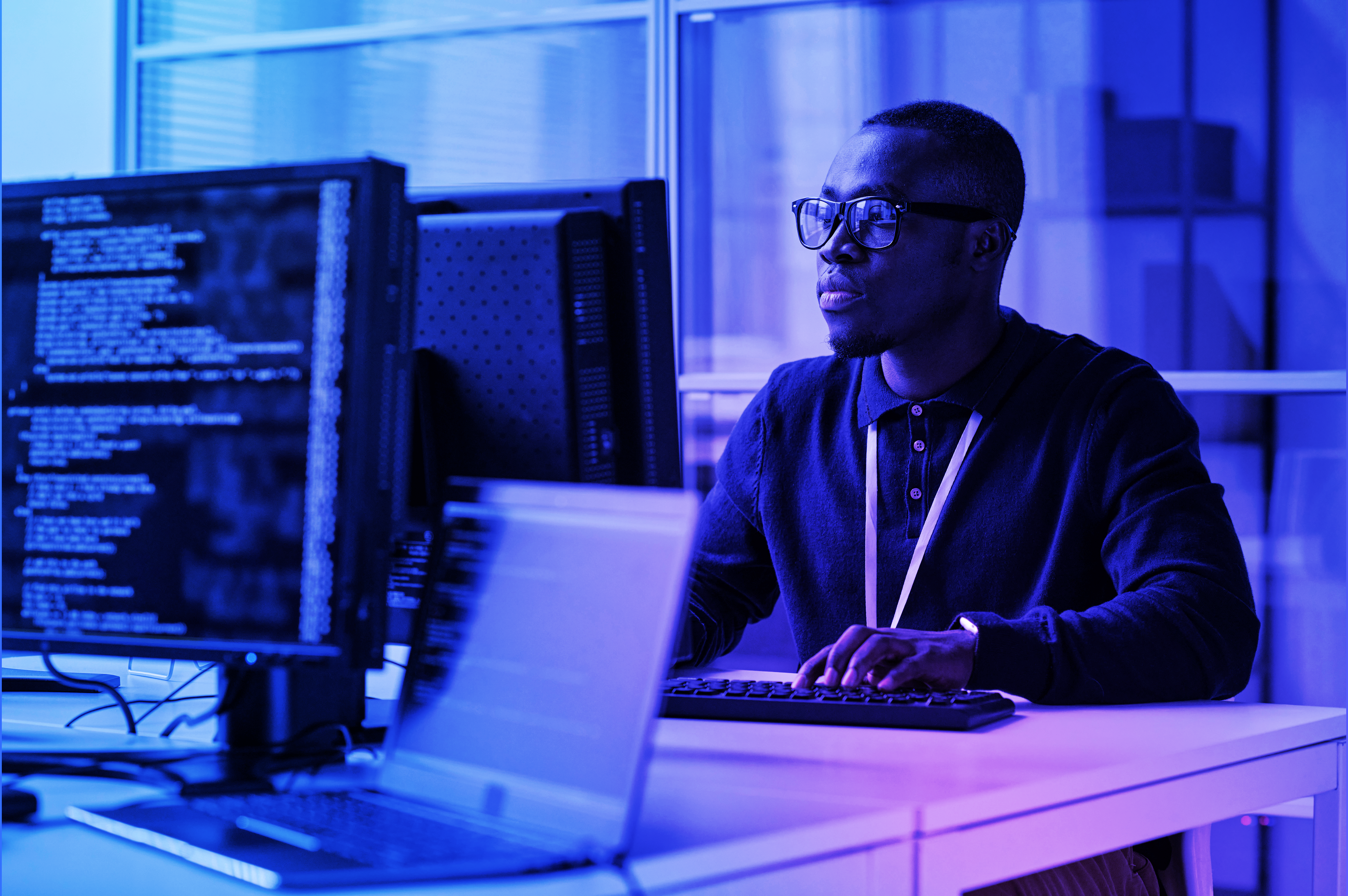 Person looking intently at a computer screen displaying Crane Authentication security data