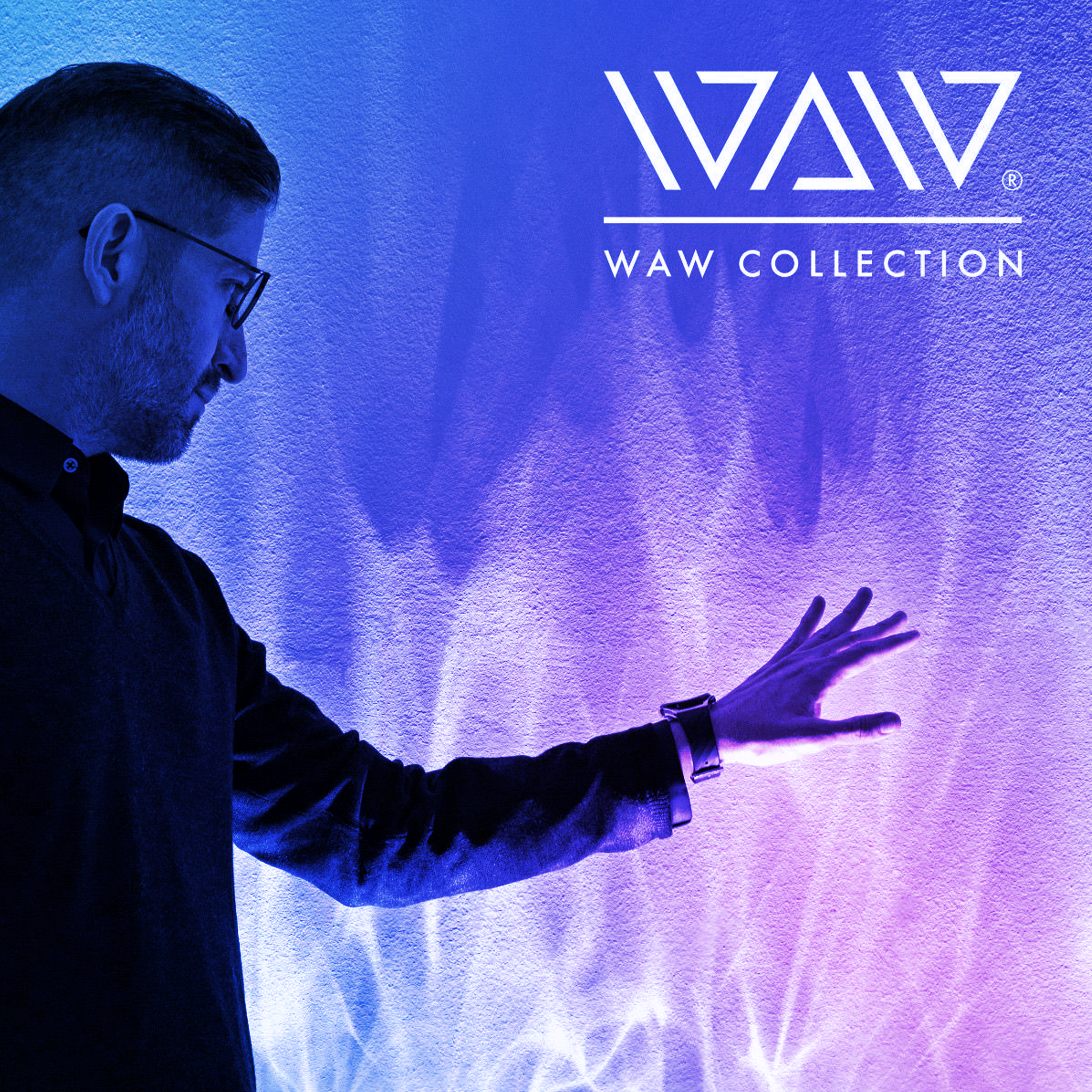 Close up of a man’s hand interacting with the WAW COLLECTION BE WATER Lamp and illuminated design details